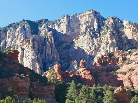 Rocky mountain landscape with green trees below