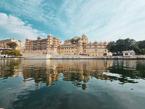 a large building sitting on top of a lake