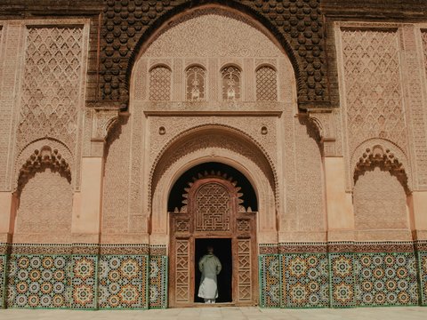 person standing on opened door of building