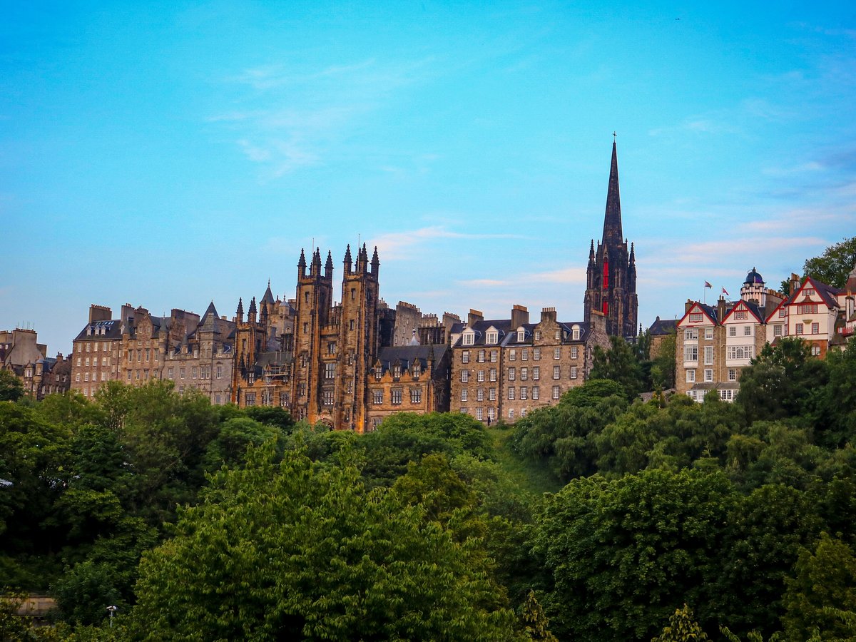 a view of a city with tall buildings and trees