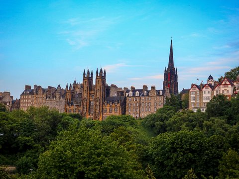 a view of a city with tall buildings and trees