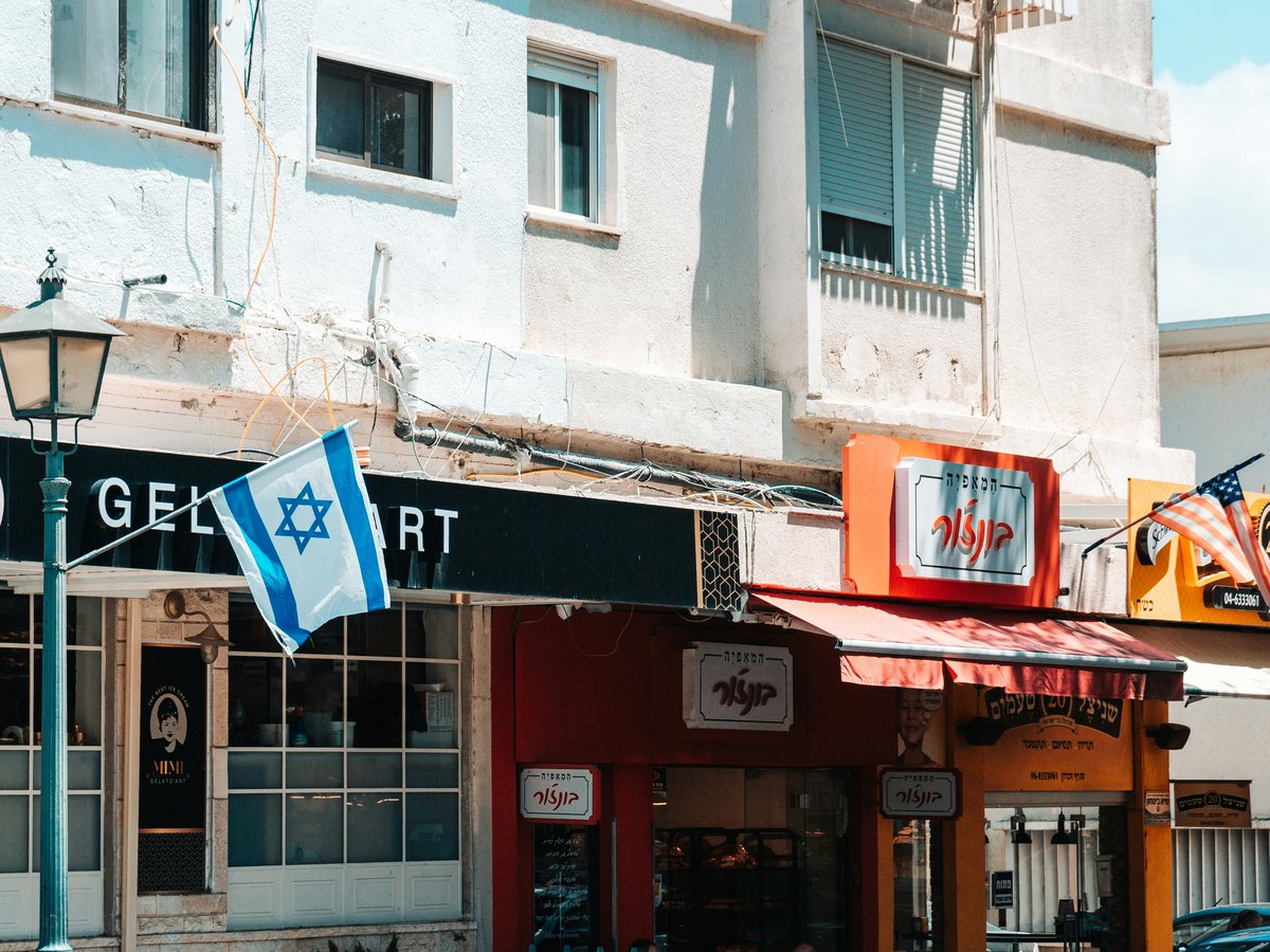 a street corner with a few shops on the corner