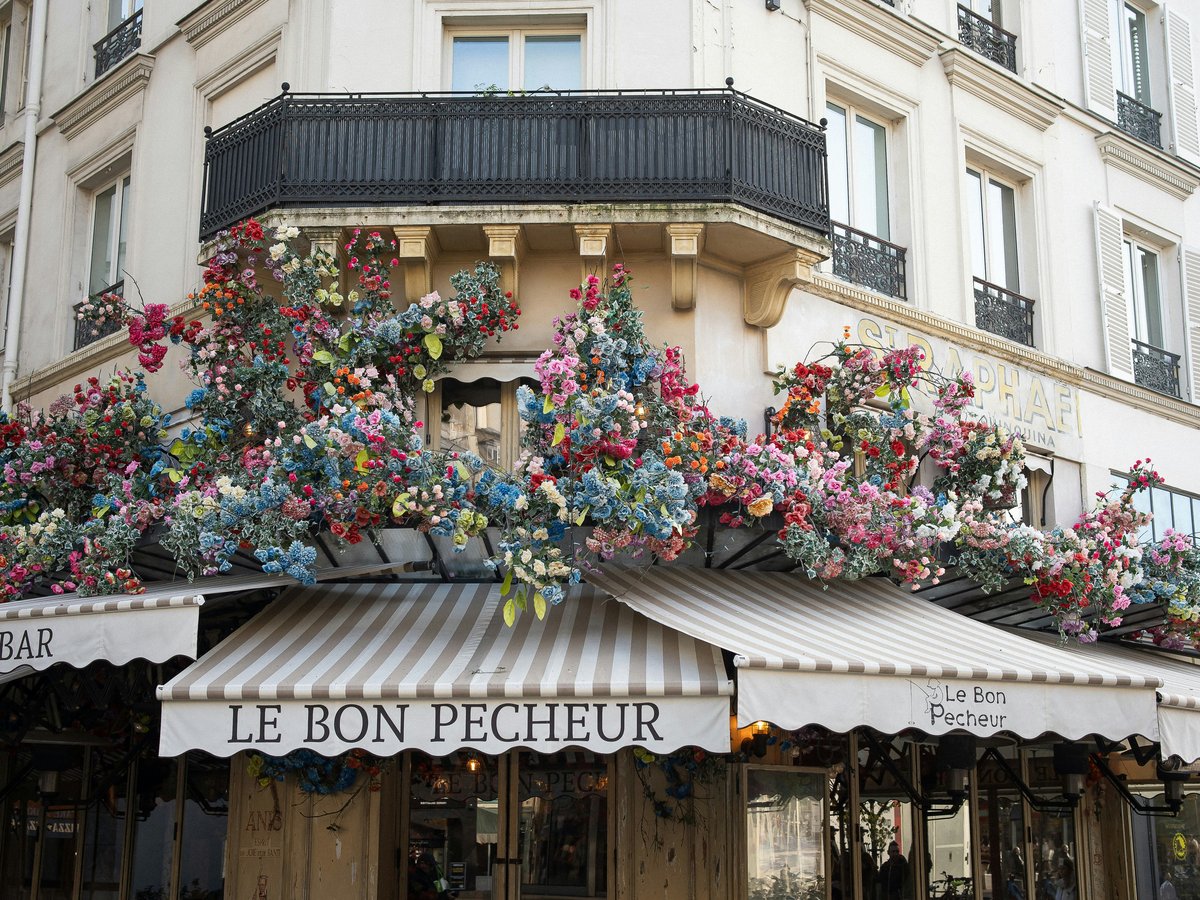 A building that has a bunch of flowers on it
