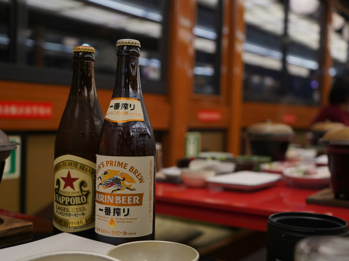 Two bottles of kirin beer on a table.