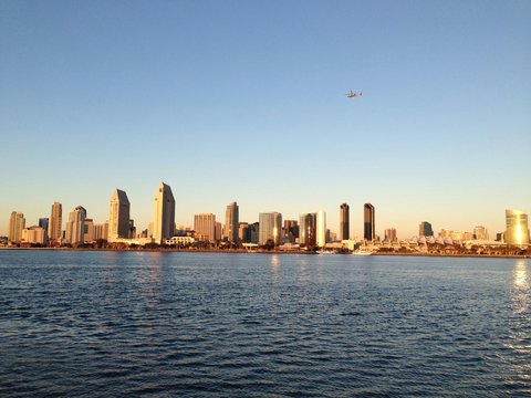 high-rise building near calm body of water