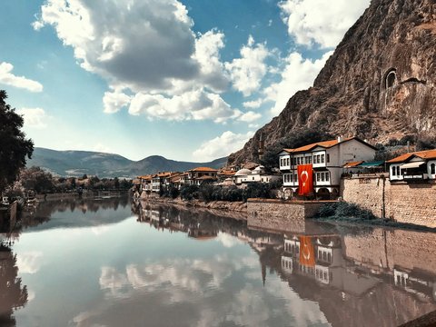 buildings beside calm body of water