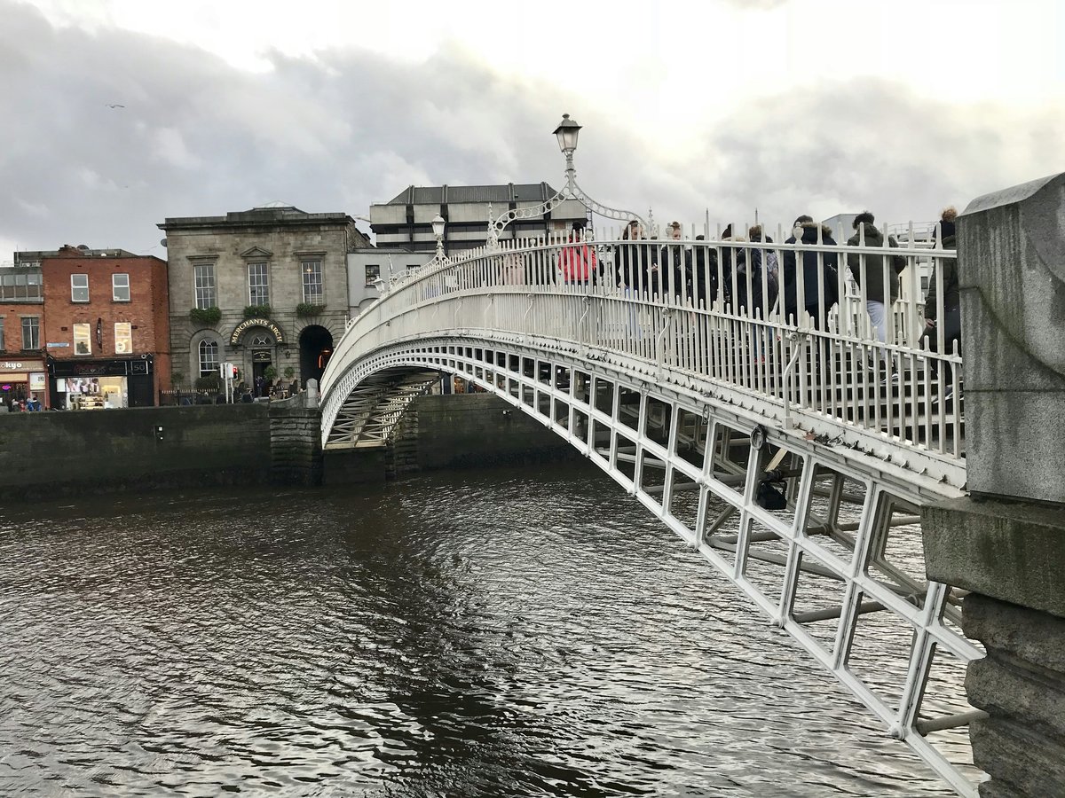 white bridge over river during daytime