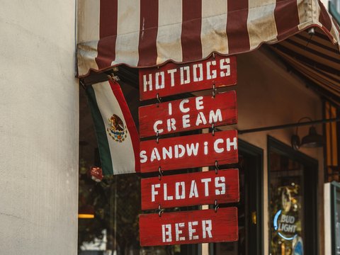 a sign that says hotdogs ice cream sandwich floats beer