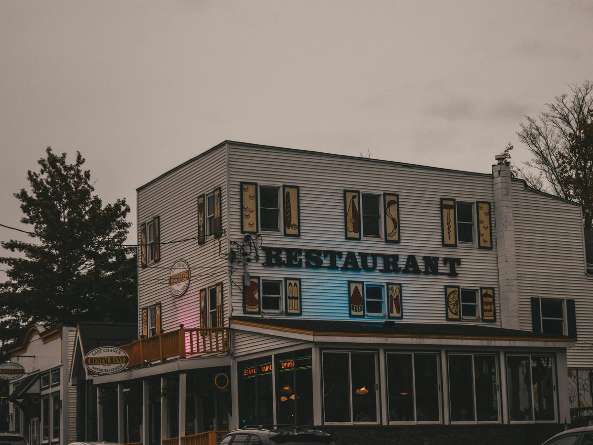 a large white building sitting next to a street