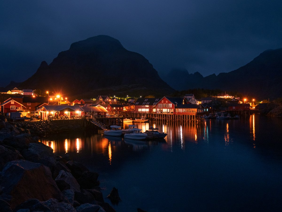 a harbor filled with lots of boats at night