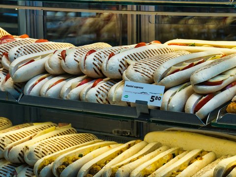 Sandwiches are displayed inside a bakery.