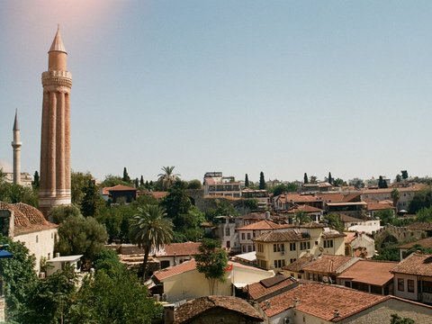 a tall tower towering over a city filled with buildings