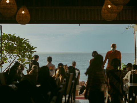a group of people standing in front of an open door