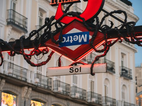Madrid metro sol station sign at dusk