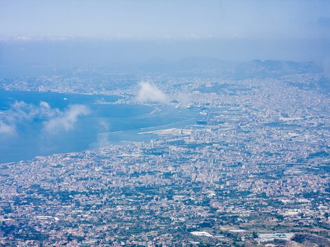 a city with a cloud in the sky