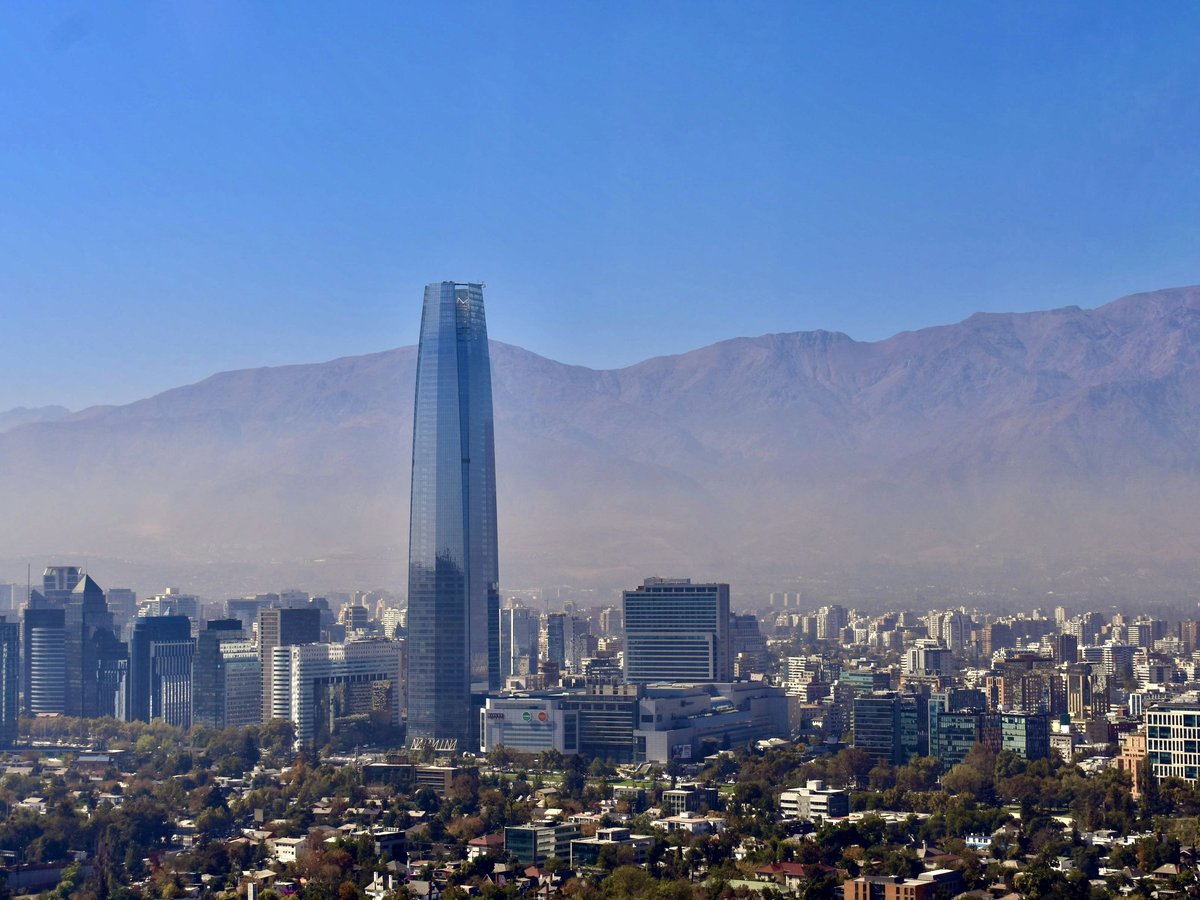 a view of a city with mountains in the background