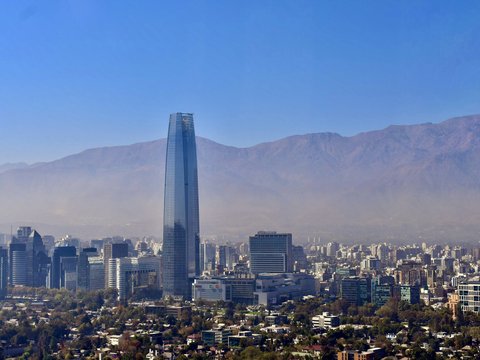 a view of a city with mountains in the background