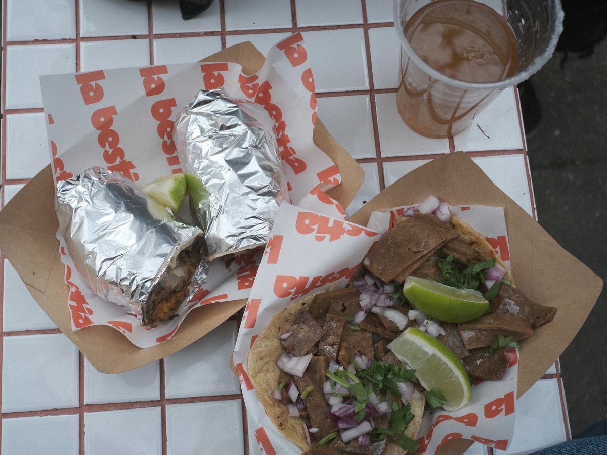 Delicious tacos and a drink are ready to be enjoyed
