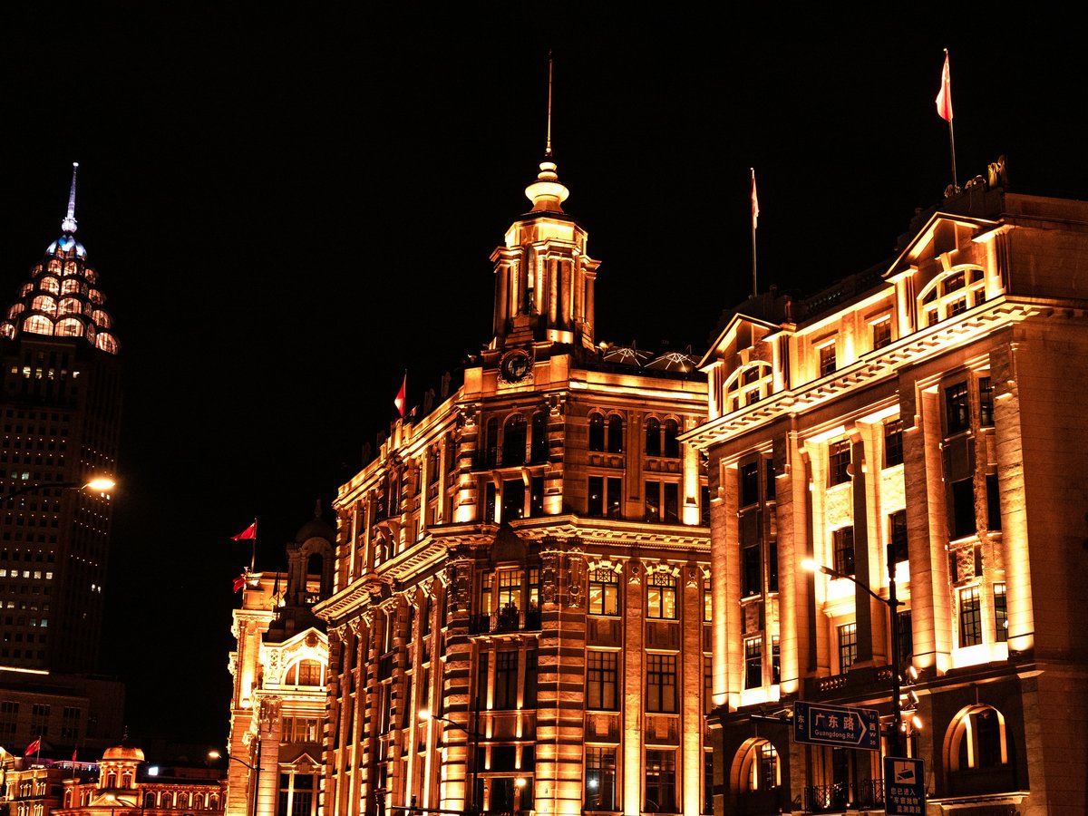 a large building with a clock tower at night