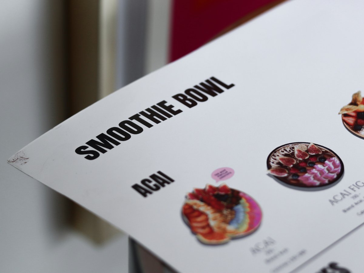 a close up of a menu on a table