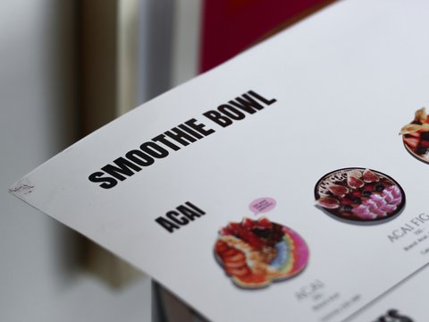 a close up of a menu on a table