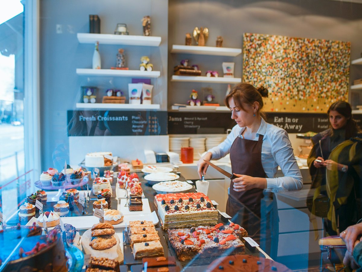 woman slicing cake