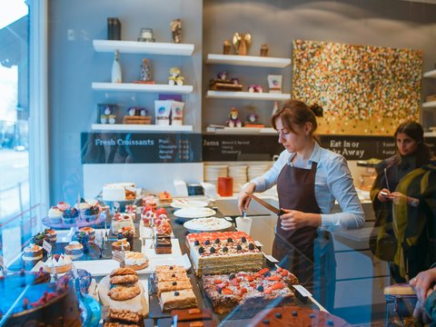 woman slicing cake