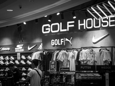 a black and white photo of a golf store