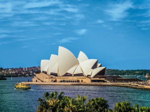 yellow boat near Sydney Opera, Australia during daytime