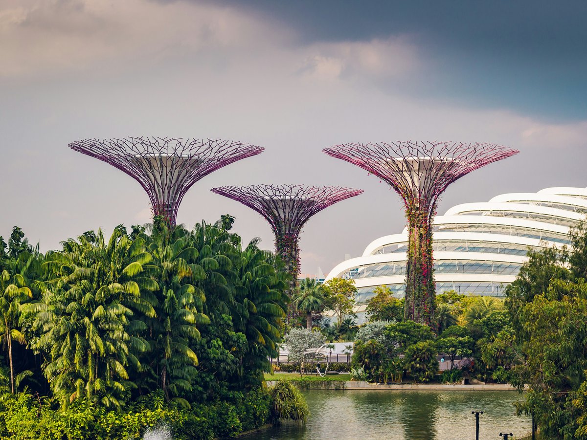 three multicolored landmarks under blue and white sky
