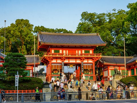Traditional japanese temple gate with surrounding greenery