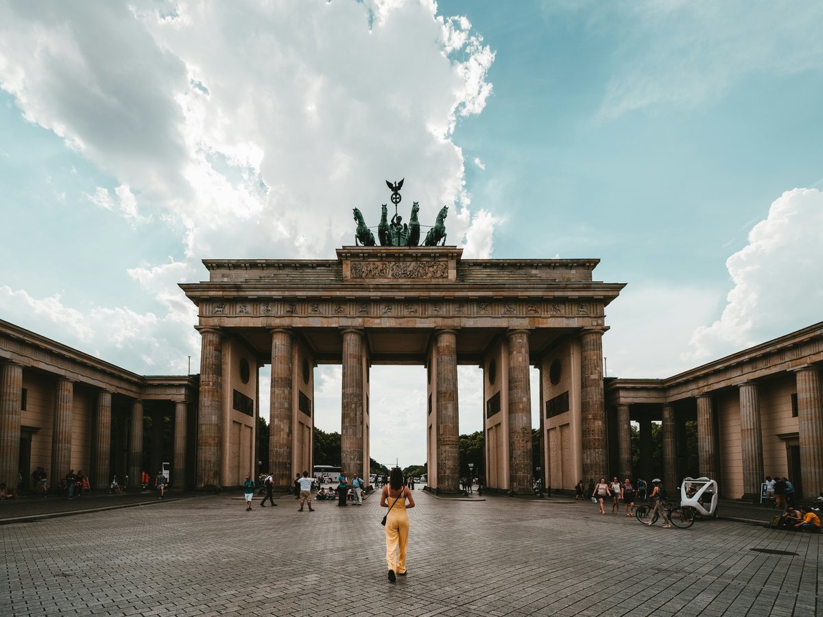 woman standing near building