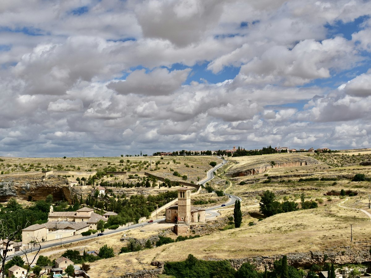 a landscape with buildings and trees