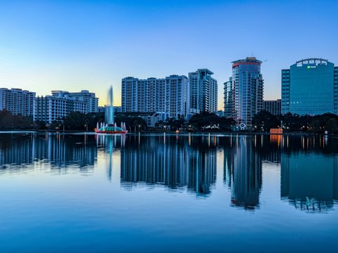 city skyline across body of water during daytime