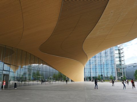 A large building with people walking around it