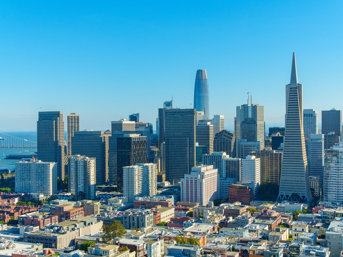 An aerial view of a city with tall buildings