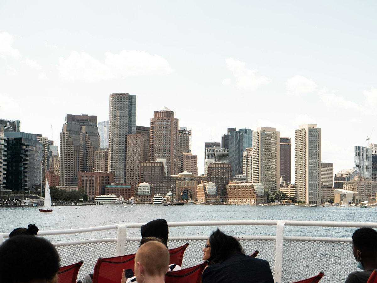 a group of people sitting on top of a boat