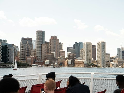 a group of people sitting on top of a boat