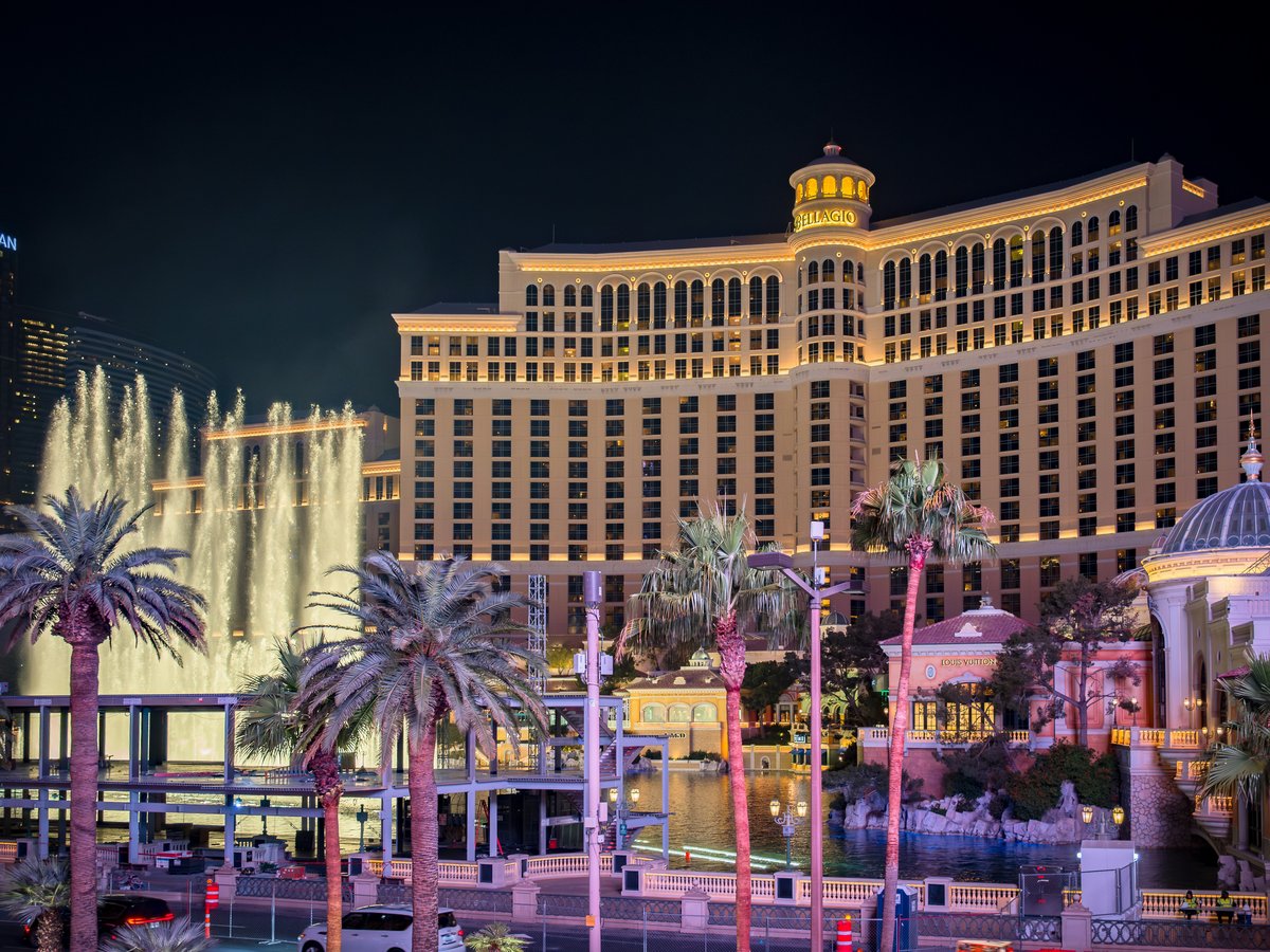 The las vegas hotel and casino is lit up at night