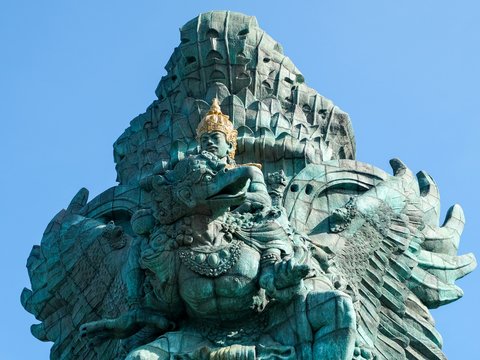 a statue of an elephant with a bird on its back