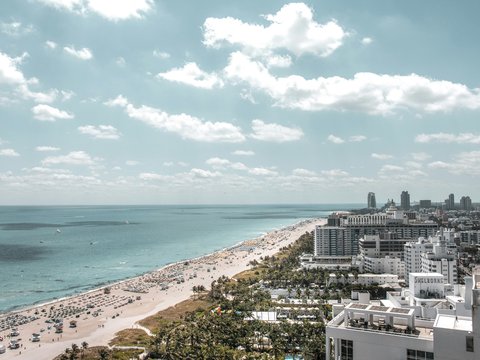 aerial photo of buildings beside beach