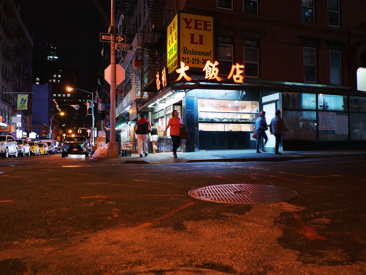 people walking on street during night time