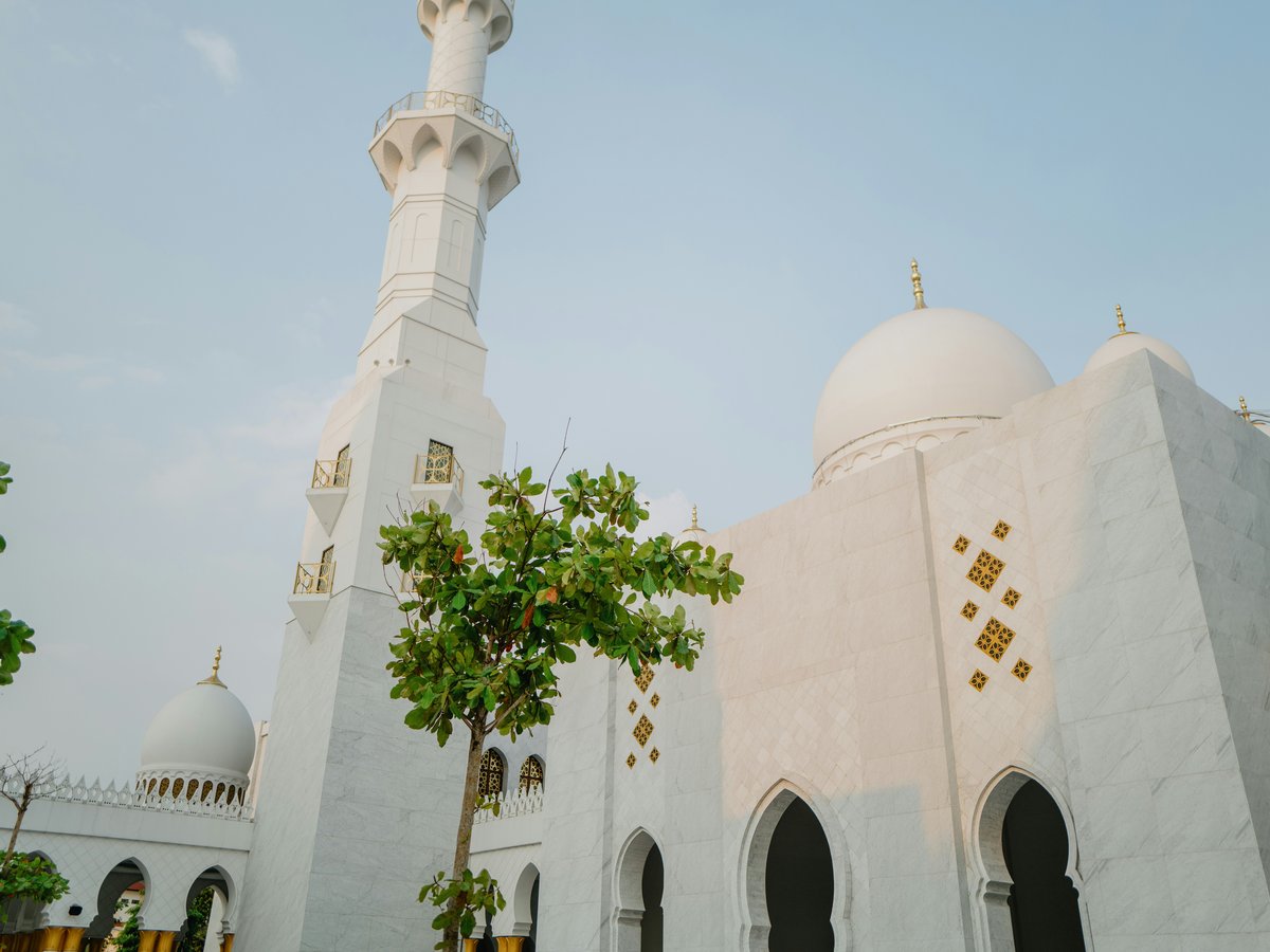 a large white building with a tall white tower