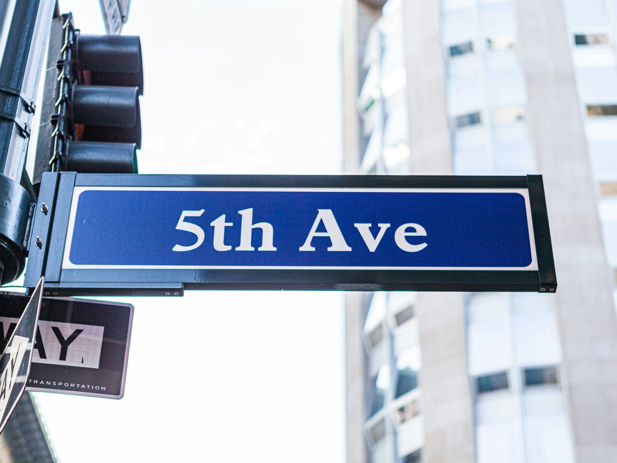 blue and white UNK street sign