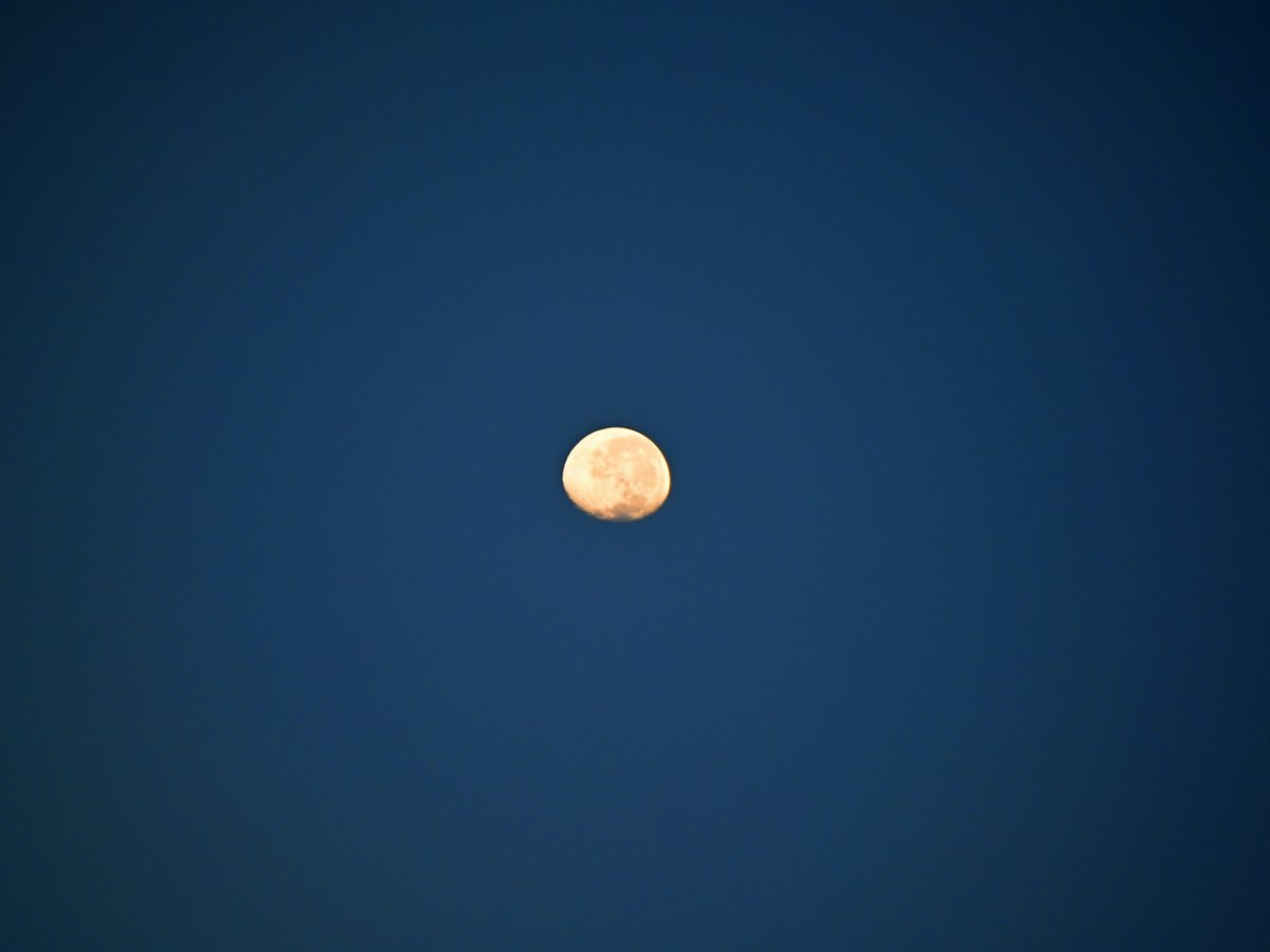a moon in a blue sky