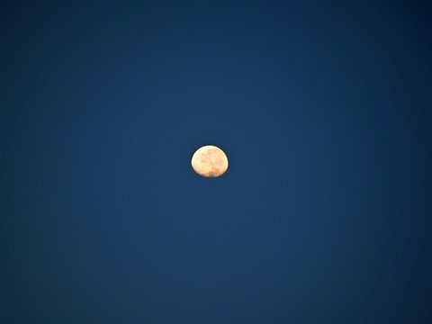 a moon in a blue sky