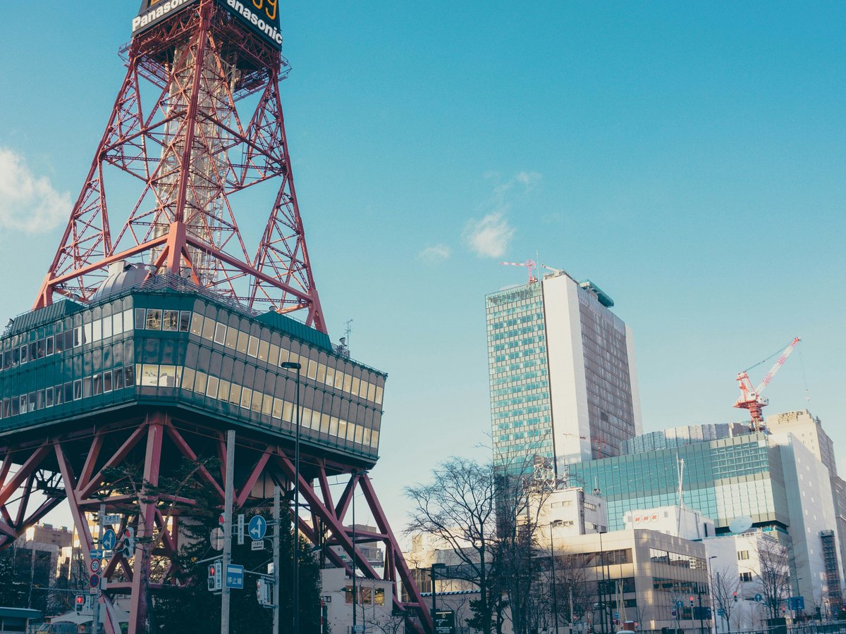 red and black tower beside building