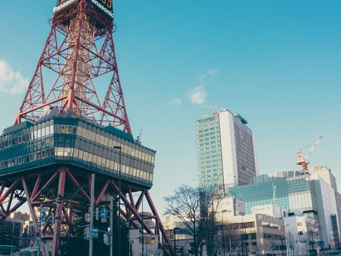 red and black tower beside building