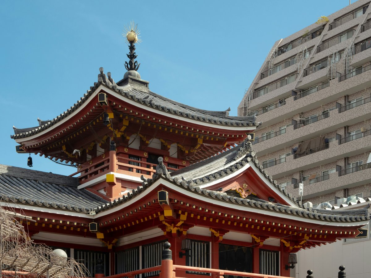 a tall red building with a tower on top of it
