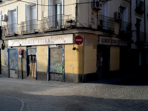 a street corner with a stop sign in front of a building